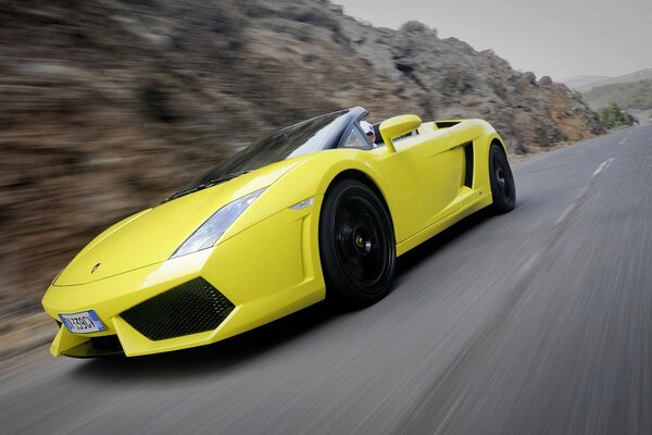 Yellow-colored lambargini eats on a serpentine