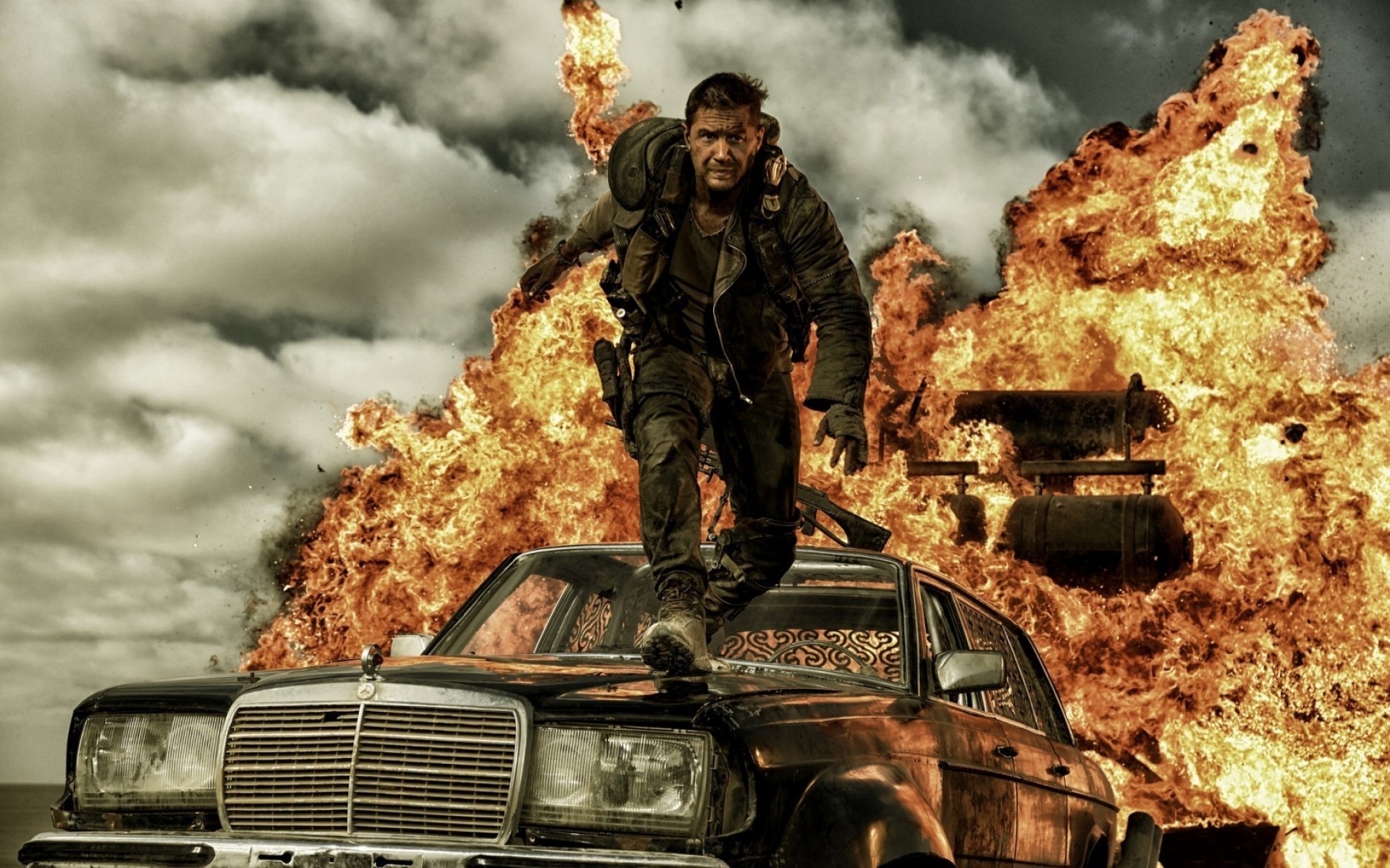 movies vehicle car flame transportation system man one war adult danger smoke outdoors travel weapon mad max tom hardy