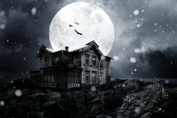 A huge moon over the old house