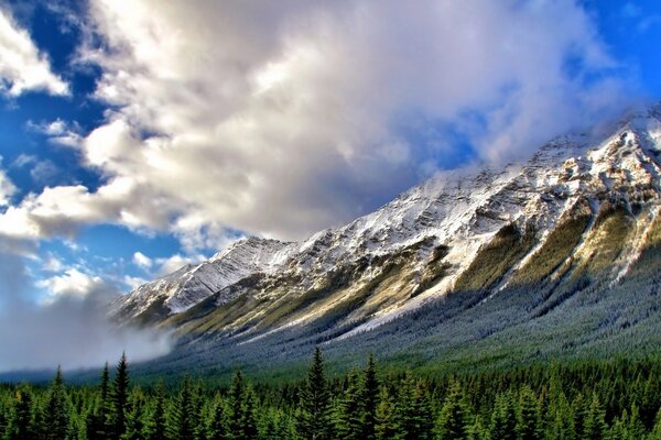 Mountain ranges in the shadow of clouds