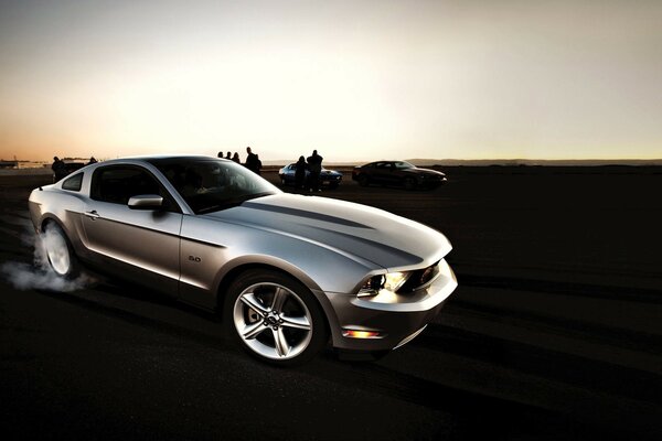 A glimpse of the sun on a luxury car