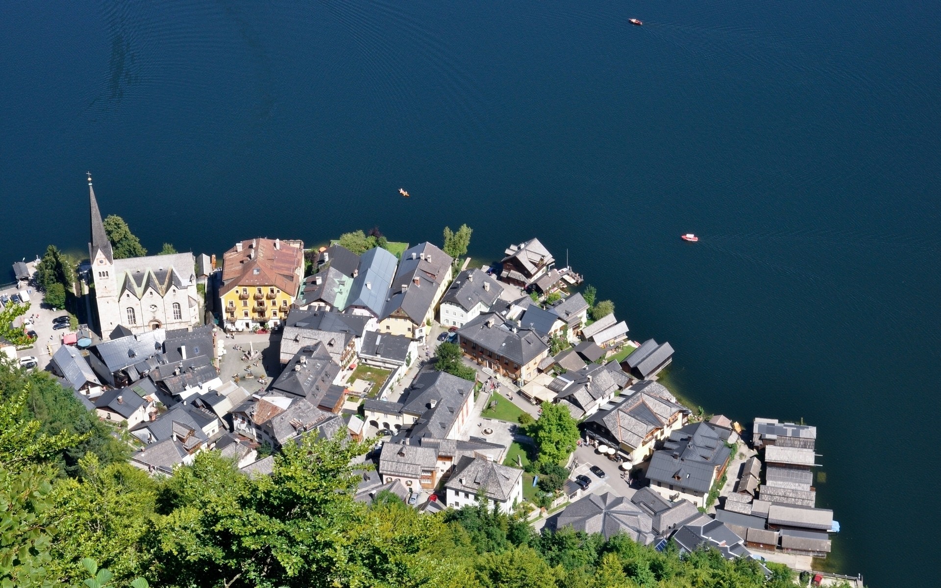 other city city architecture travel building town sky house landscape outdoors cityscape tourism church sight roof urban water hallstatt lake austria hallstatt lake