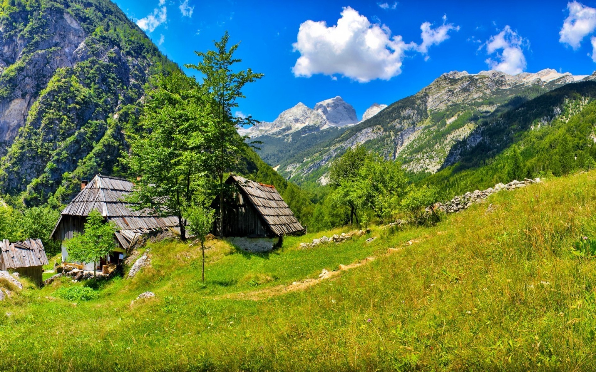 other city mountain wood landscape nature travel outdoors grass sky hut tree scenic summer hayfield valley hill house mountain peak bovec slovenia mountains