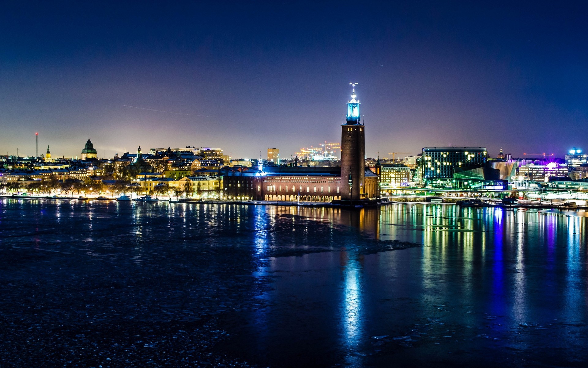 other city water city architecture sunset dusk travel cityscape evening skyline bridge reflection sky river building downtown urban waterfront pier harbor stockholm sweden night lights