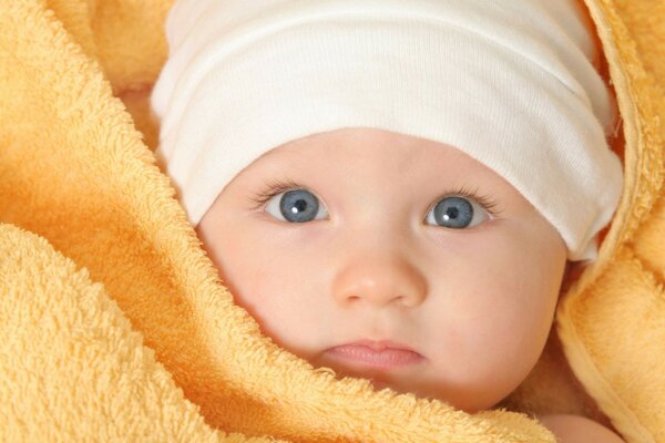 Cute baby with blue eyes and delicate skin