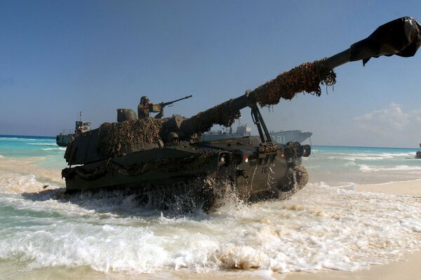 A big tank coming out of the ocean