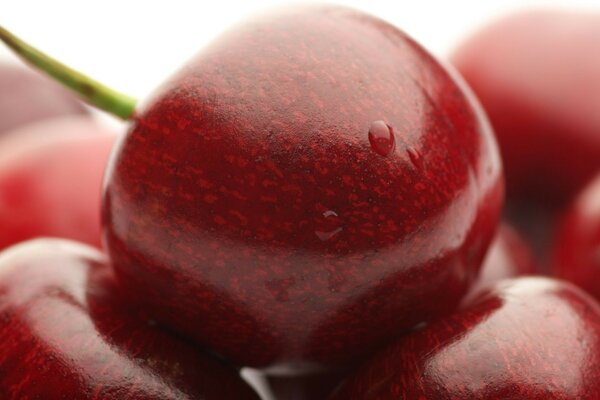 A beautiful and delicious cherry with water droplets on it