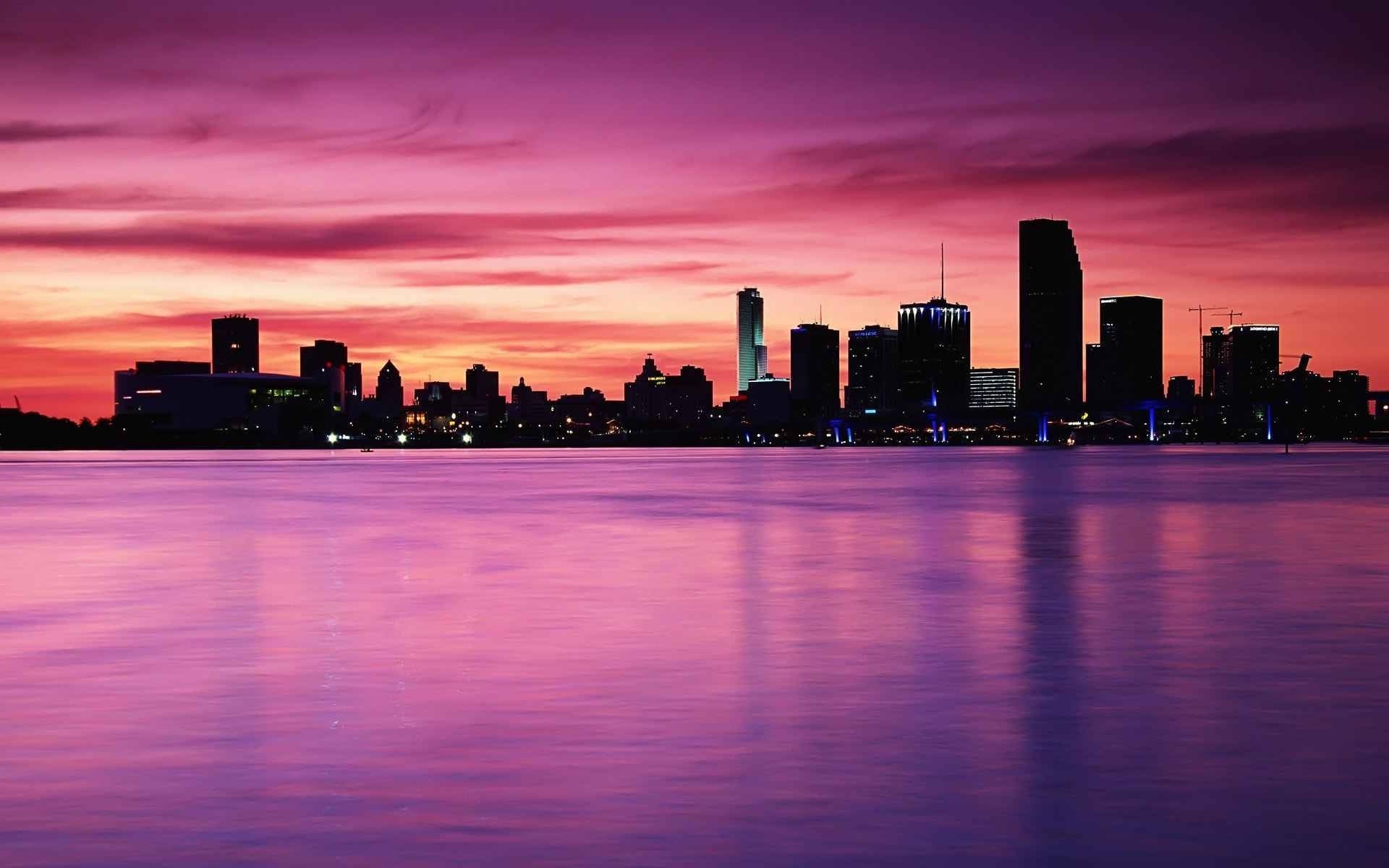 cidade anoitecer pôr do sol centro da cidade skyline arquitetura arranha-céu cidade água noite céu amanhecer reflexão viagens beira-mar casa rio porto cais