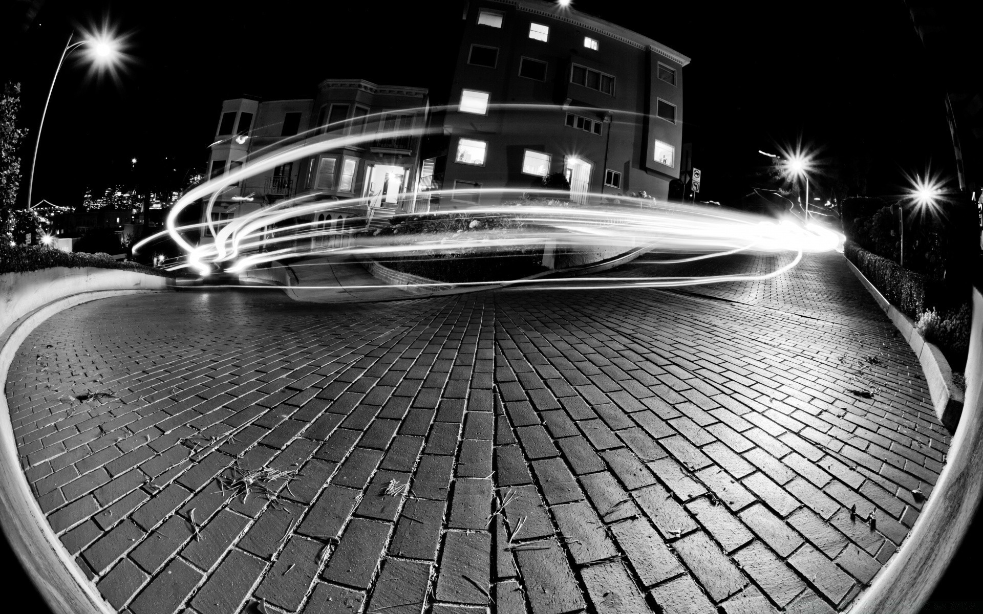 black and white street city urban architecture travel transportation system light road reflection car modern dark building monochrome