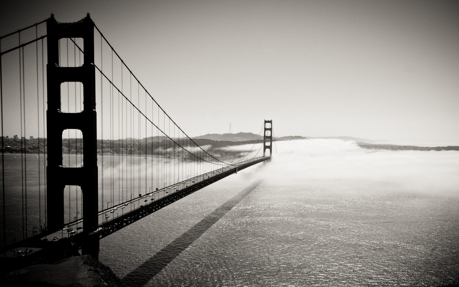 black and white bridge monochrome water sunset light reflection sea river landscape dawn transportation system suspension bridge sky city fog ocean street beach travel