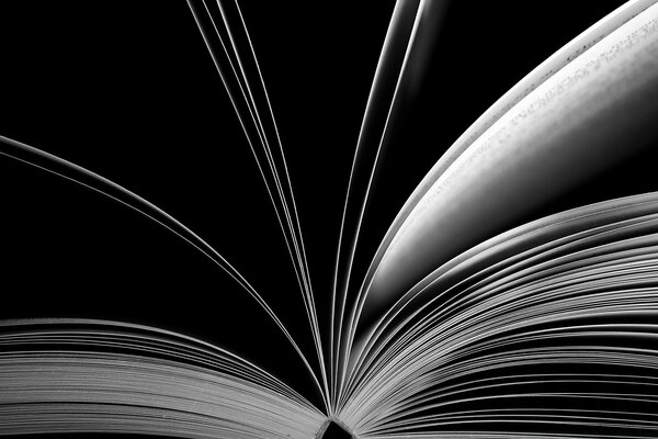 White sheets of the book on a black background