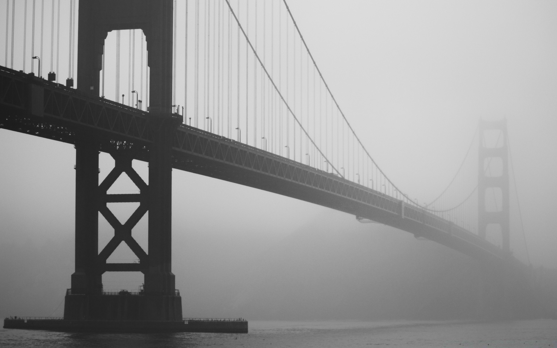 preto e branco ponte ponte suspensa água rio arquitetura sistema de transporte cidade monocromático conexão suspensão viagem céu névoa casa construção estrada urbano pôr do sol luz