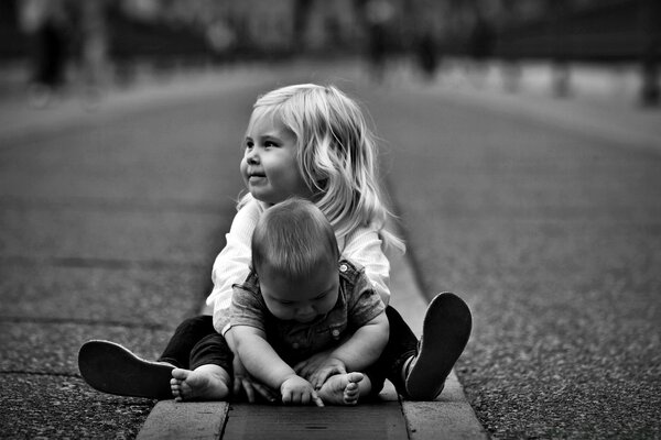 Black and white child on the asphalt