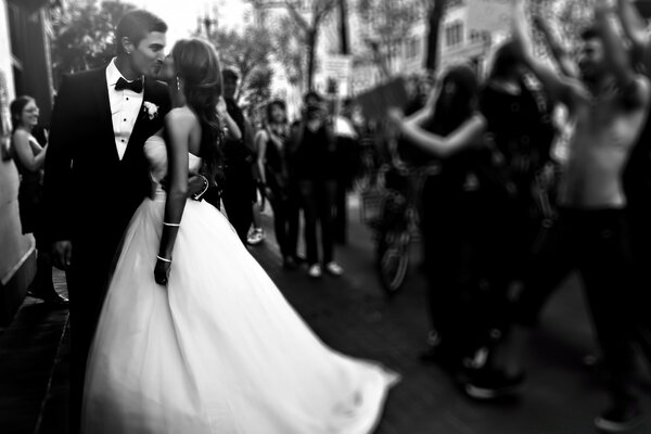 Black and white image of a wedding with the bride and groom