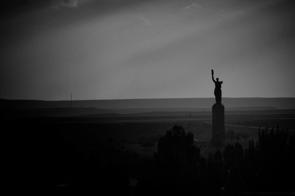 Silhouette of a statue at night