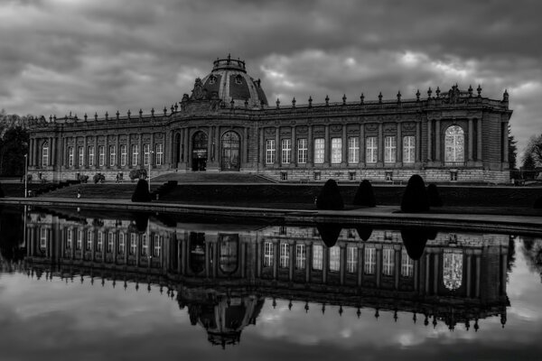 Reflection of the beautiful architecture of the city in a puddle