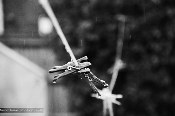 Clothesline with clothespins in the rain