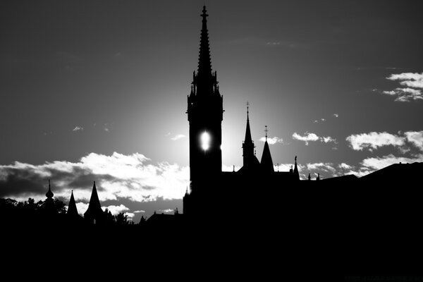 The setting sun says goodbye to the day through the window of the tower