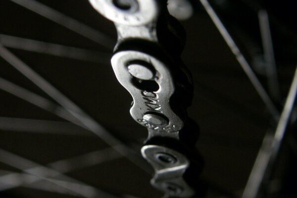 Dark black and white photo motorcycle chain