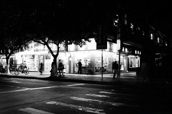 Black and white view of the street and the store