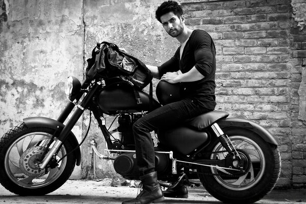 Black and white photo of a biker on the street