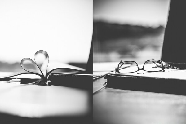 The glasses are on the book and the heart of the pages