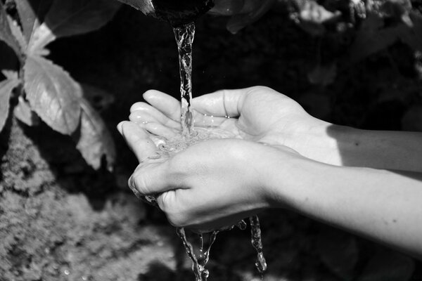 Water pours into the palm of your hand