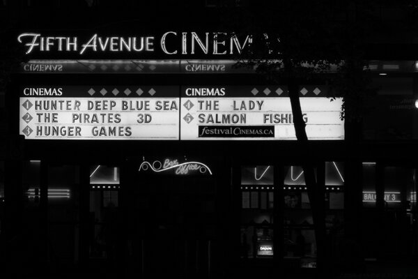 Black and white poster on the facade of the cinema