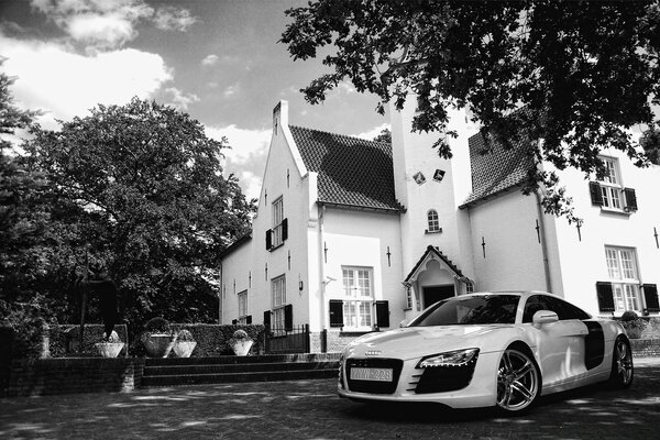 Black and white photo of a car on the street