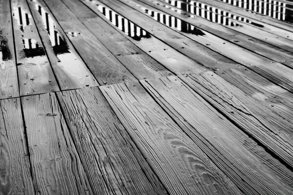 Wooden floor and puddles on the floor