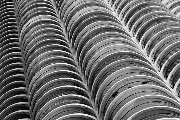 A black and white building with many floors