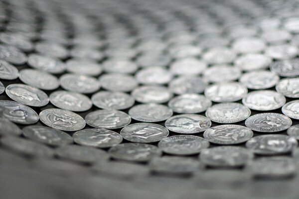 Scattered ordered coins monochrome