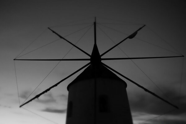 Black and white silhouette of a windmill