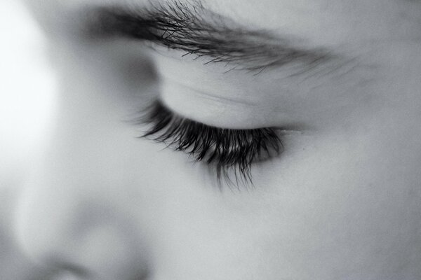 Monochrome black and white portrait with a girl s eye