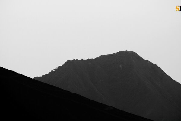 Black high mountains on a white background