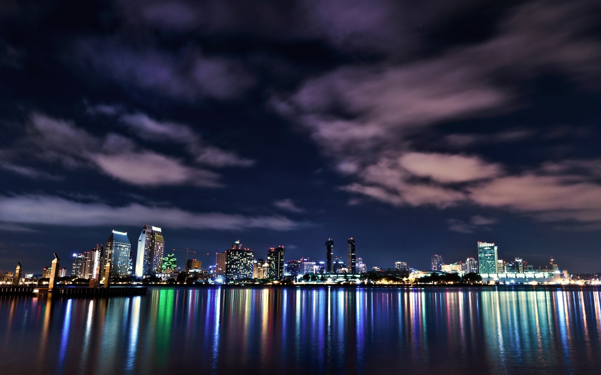 other city city skyline cityscape architecture water sunset dusk skyscraper downtown sky evening reflection river travel waterfront building harbor bridge urban