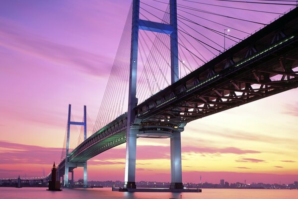 CABLE BRIDGE OVER THE RIVER IN THE MORNING