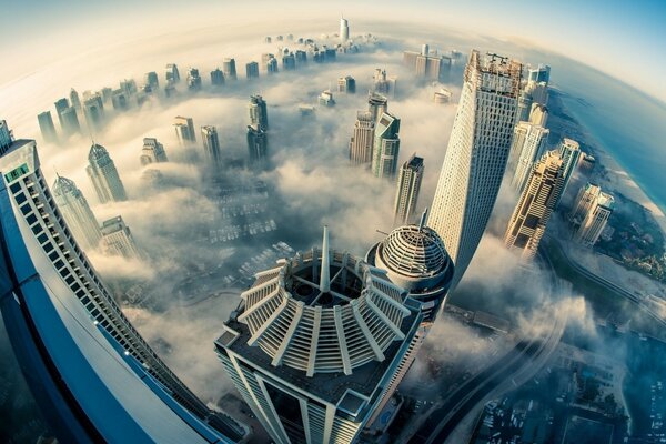 A city of tall skyscrapers in the clouds