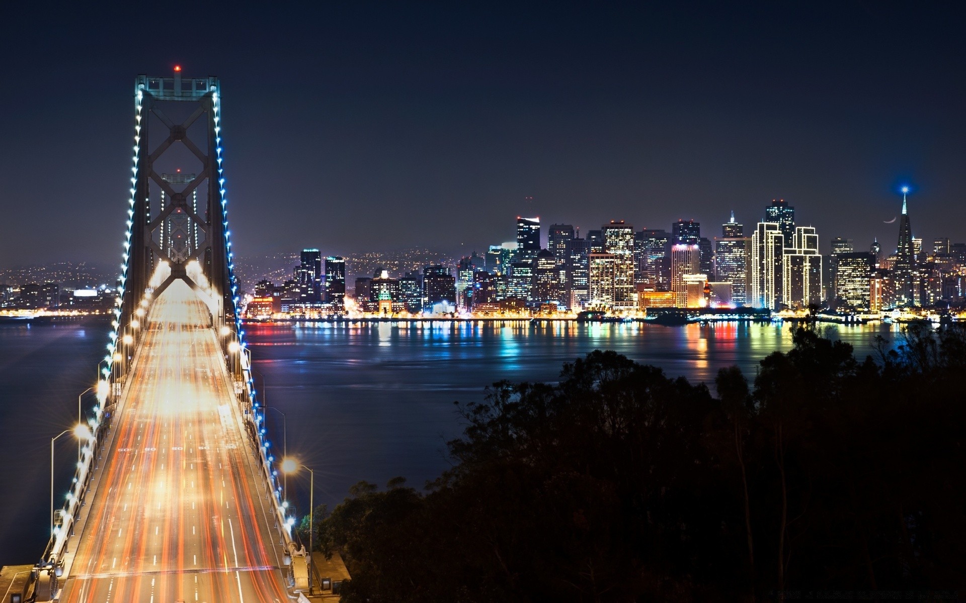 other city city bridge travel architecture cityscape water skyline dusk evening river skyscraper building urban sky sunset landmark illuminated reflection downtown