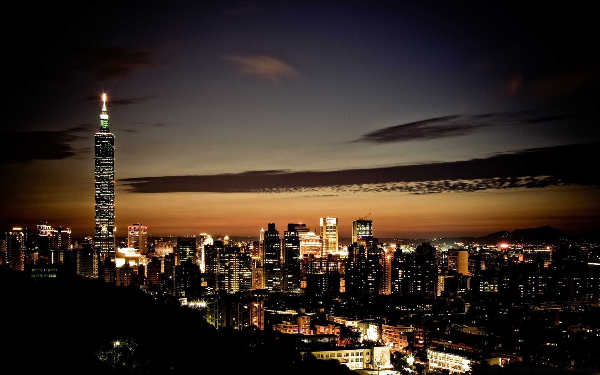 other city city sunset skyline dusk architecture cityscape travel downtown evening skyscraper sky water building light urban dawn business illuminated