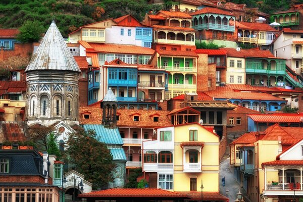 Bright colored houses surrounded by greenery