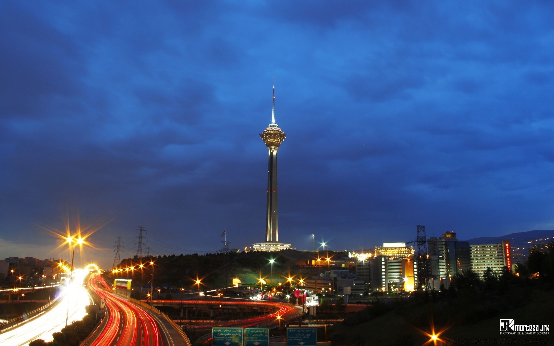 other city dusk travel traffic city evening architecture sky downtown sunset transportation system outdoors bridge cityscape skyscraper building illuminated road skyline street