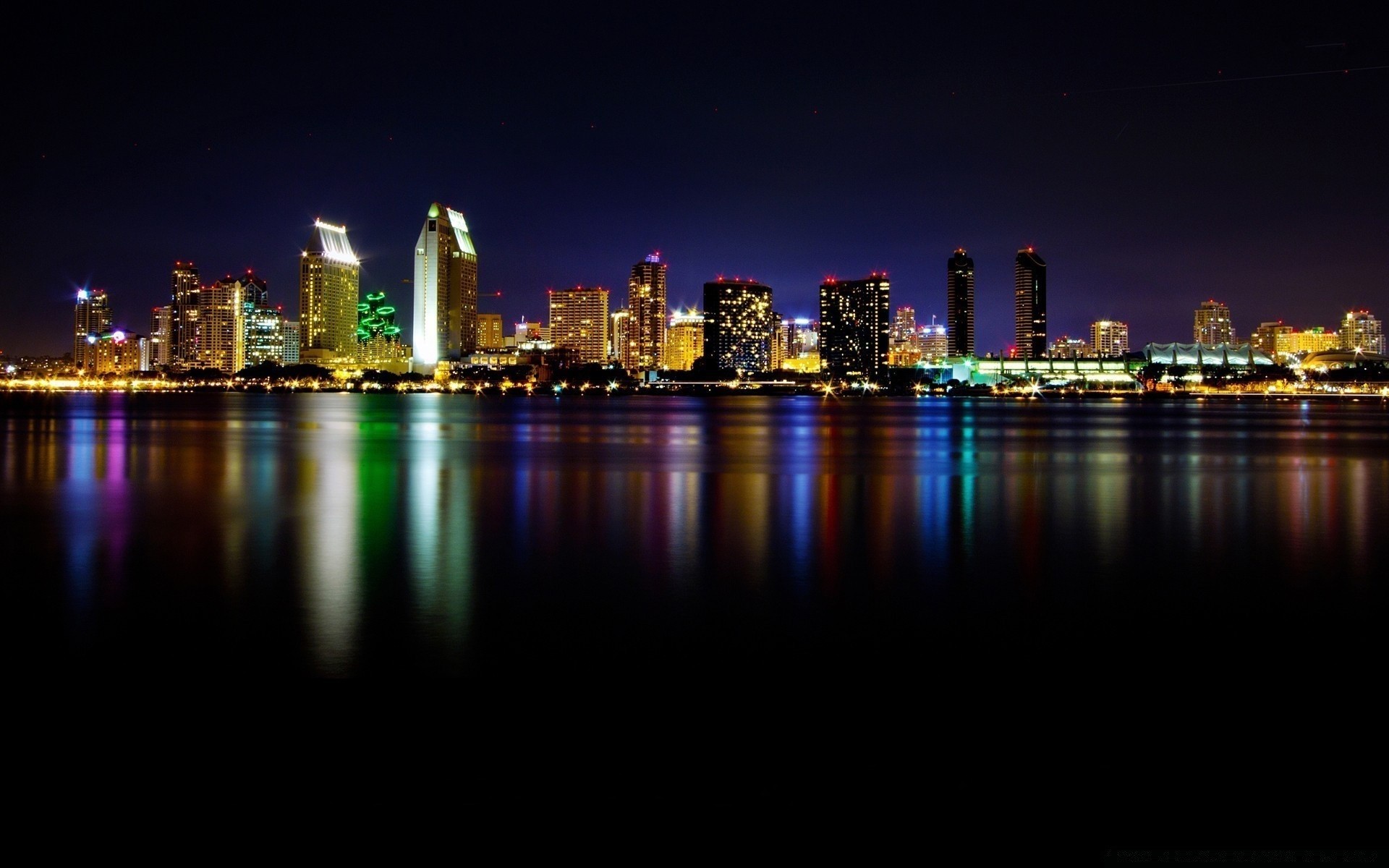 other city city downtown skyline architecture cityscape dusk water reflection skyscraper evening sunset river office waterfront sky building illuminated harbor business urban