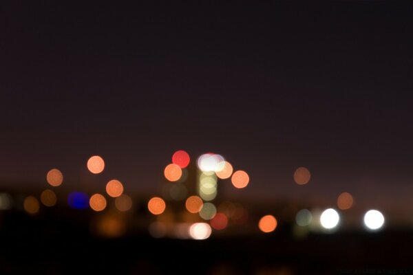 Silhouettes of city lights in the night