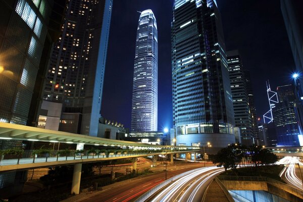 Dynamic night landscape with skyscrapers and highways