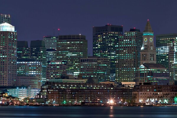 Evening city. The wall of high-rise buildings