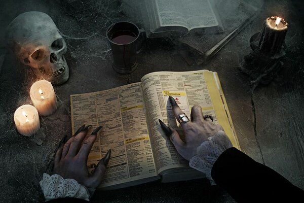 The witch s hand shows the text in the book