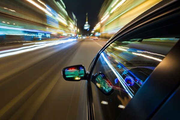 A fast-moving car through the streets of the city