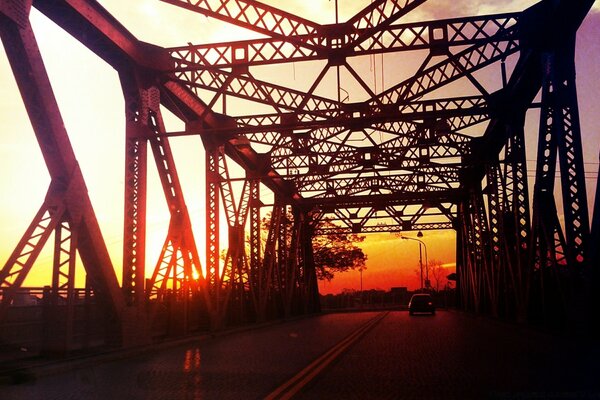 A bright sunset at a huge bridge