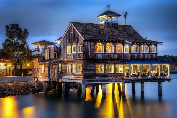 A small house above the surface of the ocean